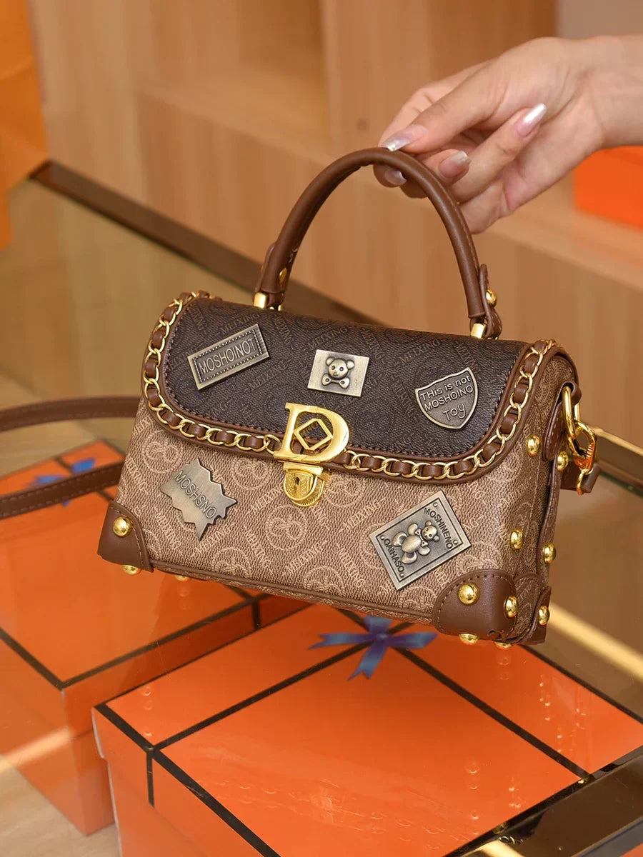 Retro torba na ramię z monogramem i złotymi detalami Zelda™