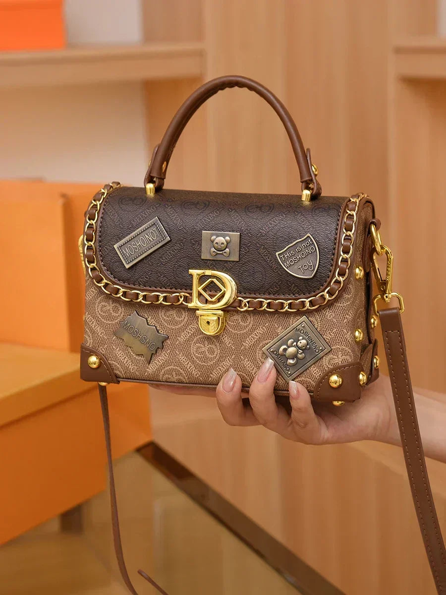 Retro torba na ramię z monogramem i złotymi detalami Zelda™