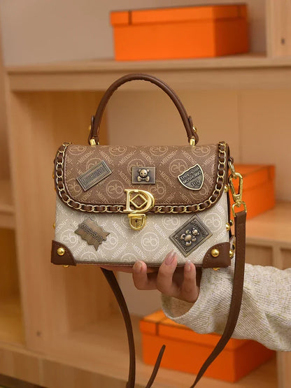 Retro torba na ramię z monogramem i złotymi detalami Zelda™